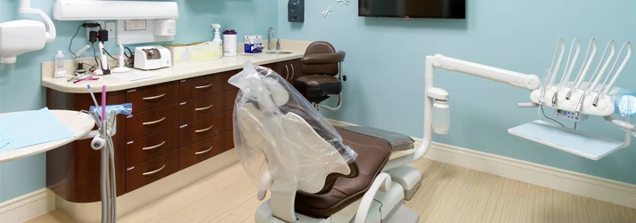 Blue Dental Examination Room with Tools