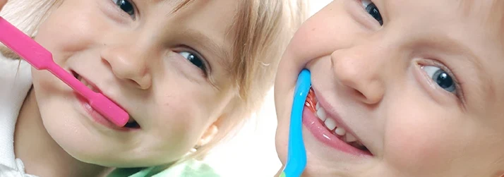 Dentist Topsham ME Close-up of Children Smiling and Brushing Their Teeth Close-up of Children Smiling and Brushing Their Teeth