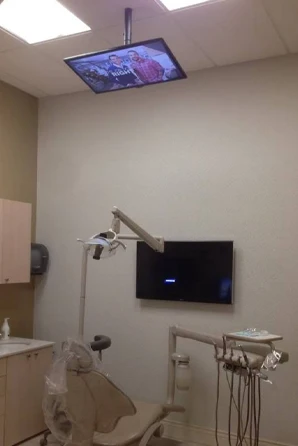 Property Brothers on the Television in Dental Exam and Cleaning Room